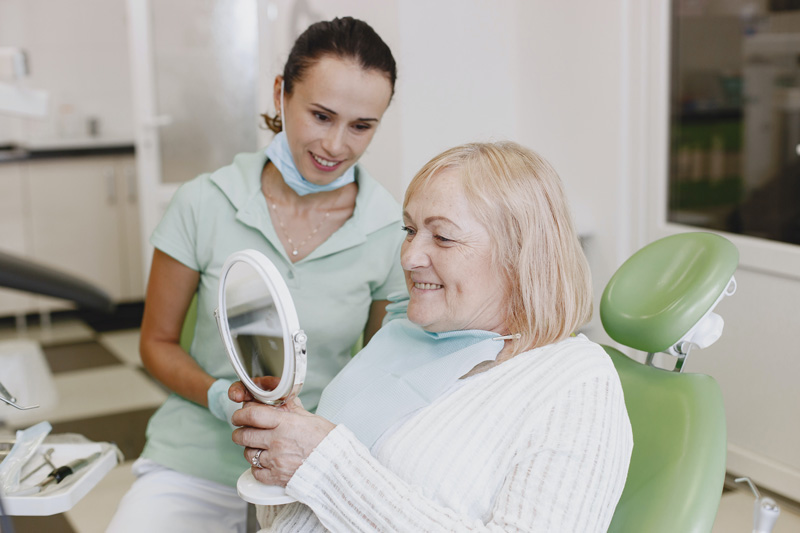 Oklahoma City dentures patient smiling about new dentures